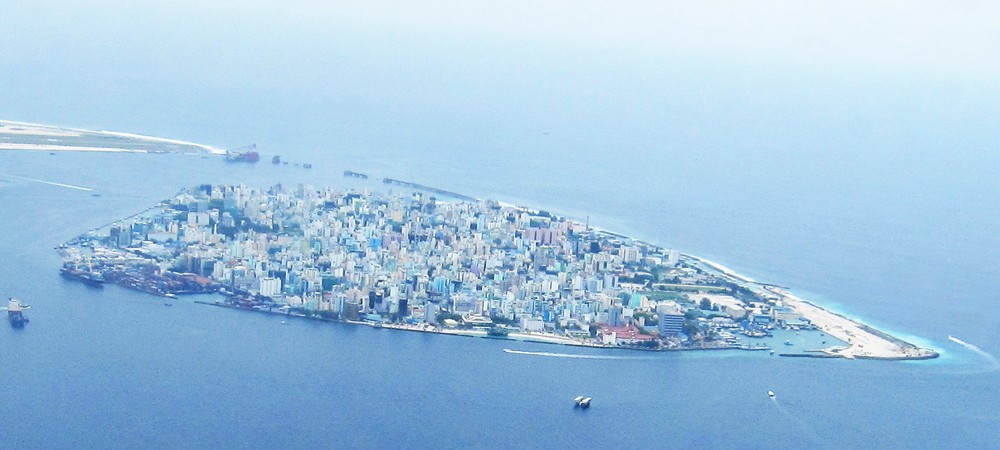 View of Male, the smallest capital city in the world, from the seaplane. You can just see the southern end of the international runway 
				on Hulule island at the top left, and you can also make out the bridge being built by the Chinese to link Male and Hulule.