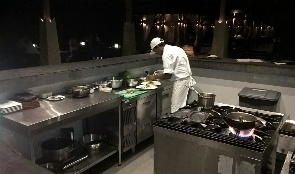A chef at Cafe Mass prepares a dish.