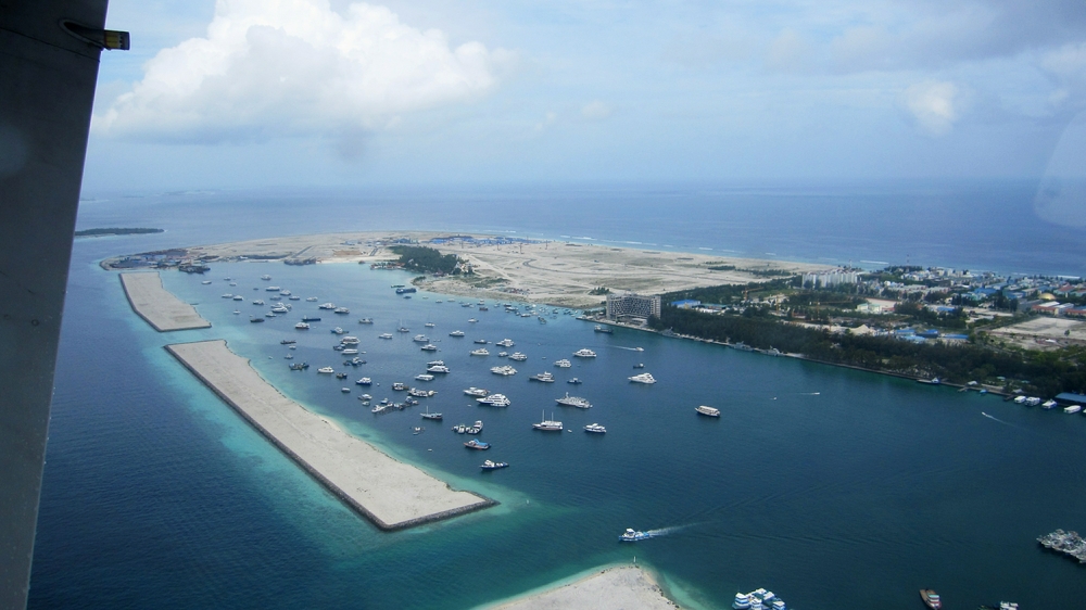 ...and this is part of the new artificial island, Hulhumale, seen from the seaplane, built over the last decade to provide overspill accommodation from 
          Male island. It is continually being expanded. You can see the large bare area at the end, ready to be built on.