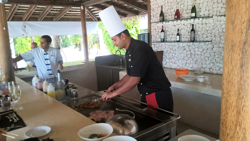 In the Teppenyaki restaurant the chef cooks a meal on the griddle for us, while Ramjee, from Nepal, tops up peoples' glasses.