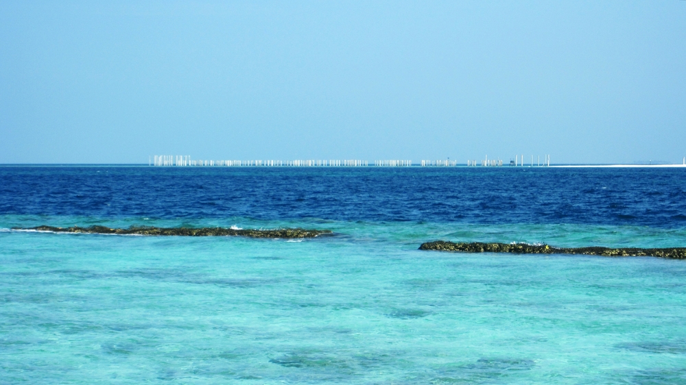 The nearby island of Innafushi has been taken over by Planhotel, and they are busy creating a luxury 25-water villa resort. 
              Here you can see pilings driven into the coral reef ready for the villas.