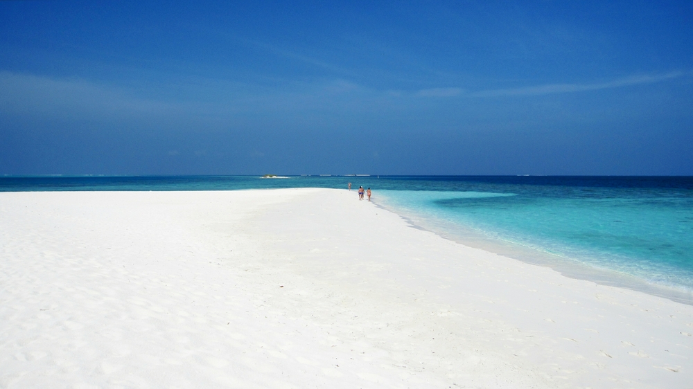 Plenty of blinding-white coral sand in the sand-spit on this SW side of the island.