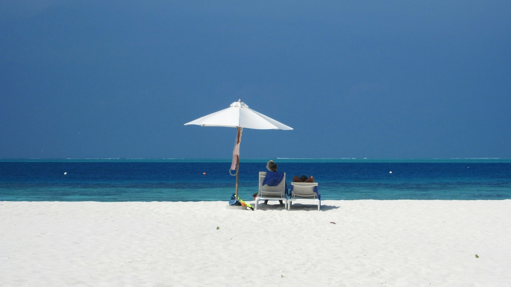 On the horizon you can see white water where the deep ocean swell is breaking over the atoll's fringing reef.