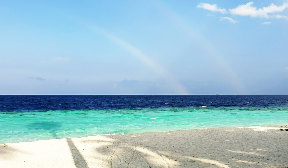 View from our Beach Villa, with a double-rainbow marking a tropical shower.