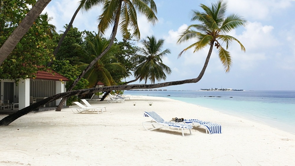 The view to the left of our beach villa, looking towards Innafushi island.