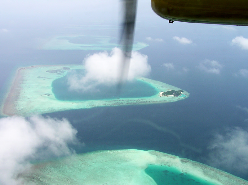 Have your camera ready on the seaplane flight over coral reefs and islands.  (116k)