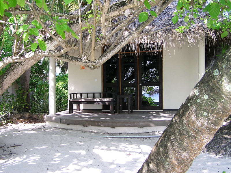 There is a small shower rose next to the covered veranda for washing the sand off your feet.  (230k)