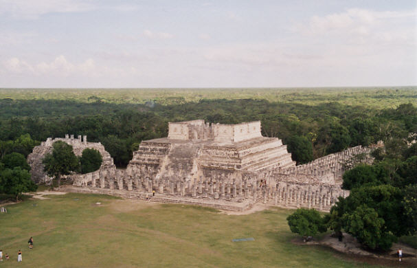 Stupendous views over the ruined Mayan buildings and
          the vast flat jungle interior of the Yucatan Peninsula (46k)