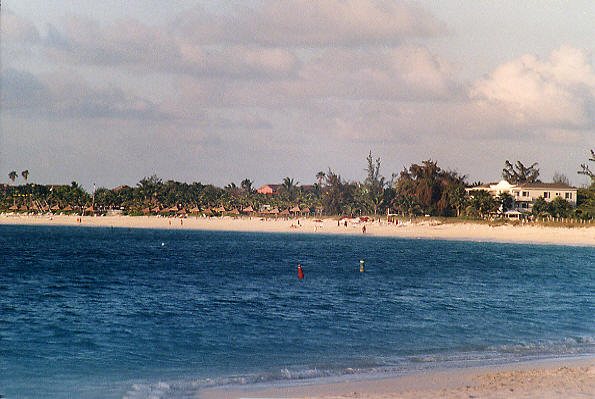 Looking west across Grace Bay from in front of Allegro, showing the sweep of the beach. (54k)