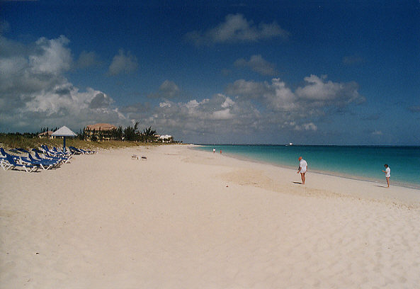 From the dive centre's jetty looking east along the beach of Grace Bay. (41k)
