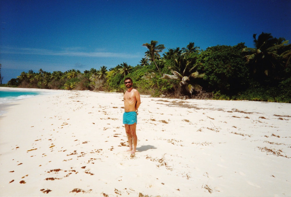 John on the beach - in the days when he had ribs.