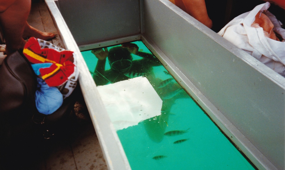 John swimming under the glass-bottomed boat.