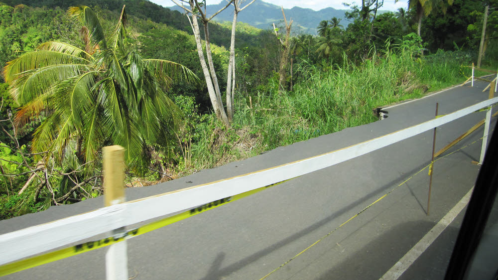 This sort of thing was common - the edge of the road has been undermined and has collapsed. The authorities have simply reduced the road to one lane.
Hopefully our side of the road is not undermined. (158k)