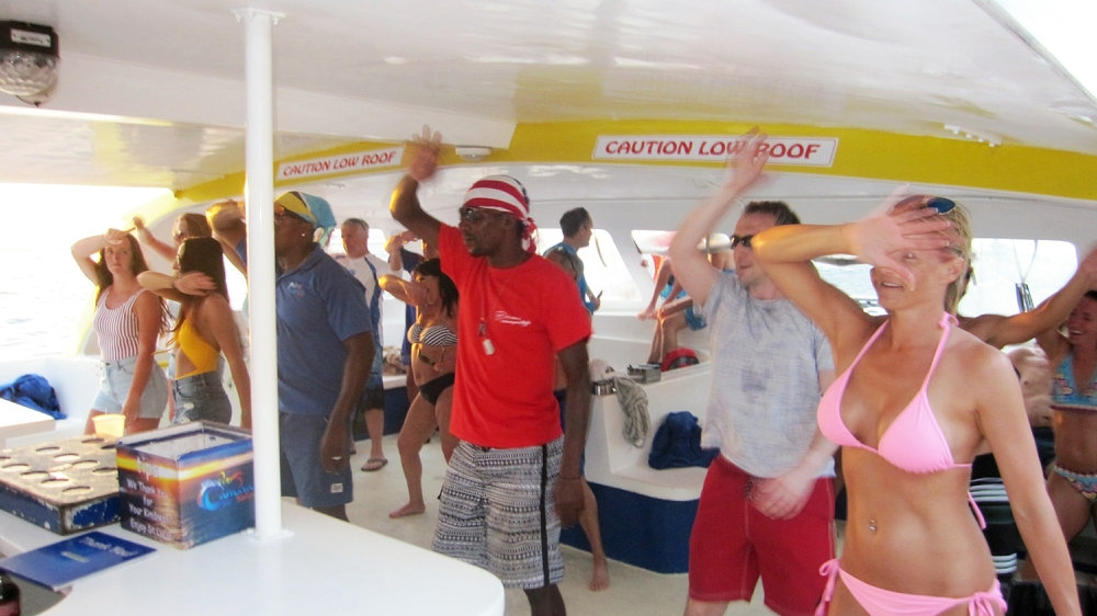 On the return trip, the crew lead the passengers in organised leaping about to reggae music.