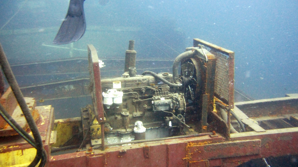 This Ford diesel engine on the deck has been left exposed to provide interest.