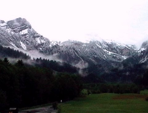 Early morning view from our balcony at Hotel Alpenland in Lauenen of fresh snow that fell during and
            after our walk on the previous day.