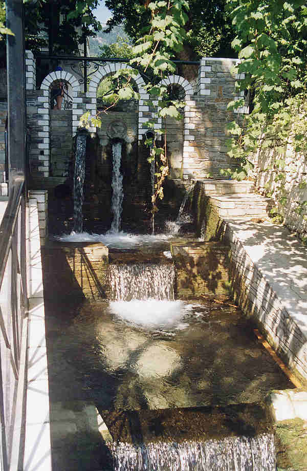 Running water channelled down ornamental gulleys in the village of Panagia.  (68k)