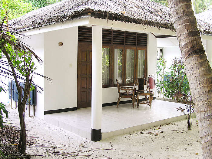 Our room - number 100, with its spacious covered verandah. Always kept spotless by the room boy. (99k)